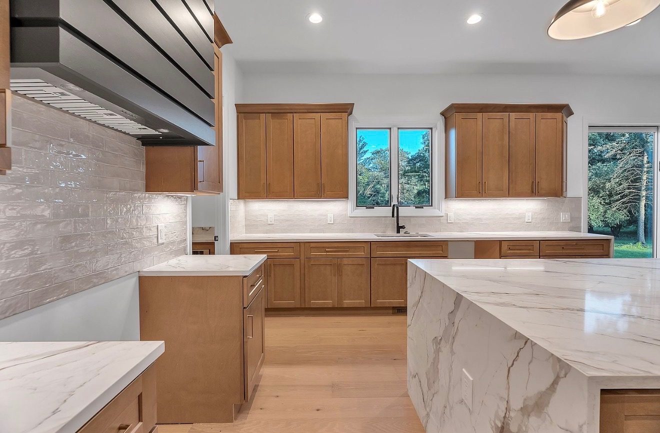 Maple kitchen sink wall with white subway tile