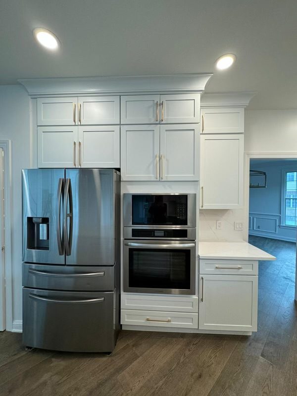 White shaker cabinets with built-in wall oven and microwave
